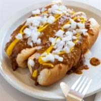 Coney Island · Smothered in chili. Topped with mustard and onions in a steamed bun.