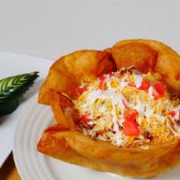 Taco Salad · Your choice of meat served in an edible tortilla bowl with lettuce tomatoes corn cheese and ...