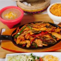 Sizzling Fajitas Dinner · Grilled veggies with your choice of meat served with rice beans and tortillas. vegetables sa...