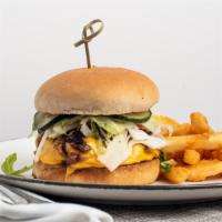 Cheese Burger Americana · Garlic aioli, caramelized onion, American cheese, pickle, shredded lettuce, tomato and brioc...