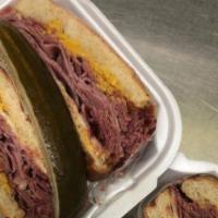 Corned Beef Sandwich · 1/2 lb, corned beef, swiss cheese, and mustard with pickle spear.