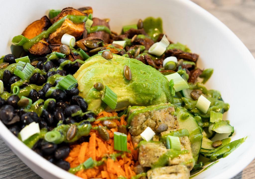 Vegan Bowl  · Brown rice, spinach, cilantro tofu, sweet potatoes, paprika mushrooms, black beans, carrots, cucumbers, green onions, roasted pumpkin seeds & sliced avocado - topped with cilantro lime dressing