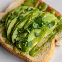 Classic Avocado Toasts (2 Slices) · Sliced avocado, cilantro, salt - topped with cilantro lime dressing