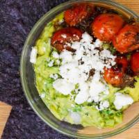 Roasted Tomato & Feta Guac  · Classic guac topped with garlic roasted tomatoes & crumbled feta. Served with chips