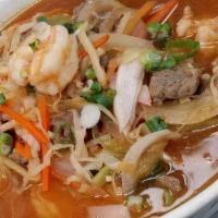 Seafood Noodle Soup · Spicy noodle soup with shrimp and imitation crab meat with veggies