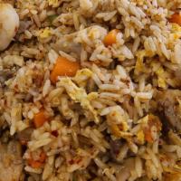 Young Chow Fried Rice · Fried rice with eggs, beef ,chicken and baby shrimp with carrots and little green onions