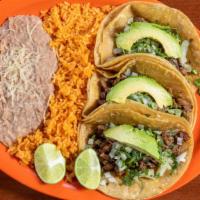 Mexican Tacos (3) · Tortillas filled with skirt steak, cilantro, onions, and avocado. Served with rice & beans.