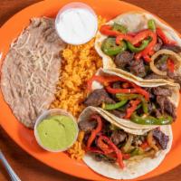 Tacos A La Plancha (3) · Grilled steak OR chicken with onions, and green and red bell peppers. Comes with a side of g...