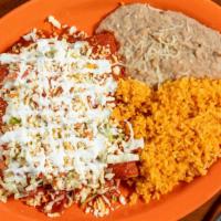 Enchiladas Rancheras (3) · Enchiladas covered with chile guajillo topped with lettuce, tomatoes, shredded anejo cheese,...