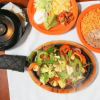 Vegetarian Fajitas · Grilled green and red peppers, onions, zucchini, cauliflower, and broccoli with guacamole, p...