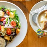 Cup Of Soup & Small House Salad · Organic spring & romaine mix w/ grape tomatoes, red onions, mozzarella, & croutons.