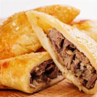Beef Samosa · Flaky, golden, fried pastry puffs filled with beef, potatoes, vegetables and warm, aromatic ...