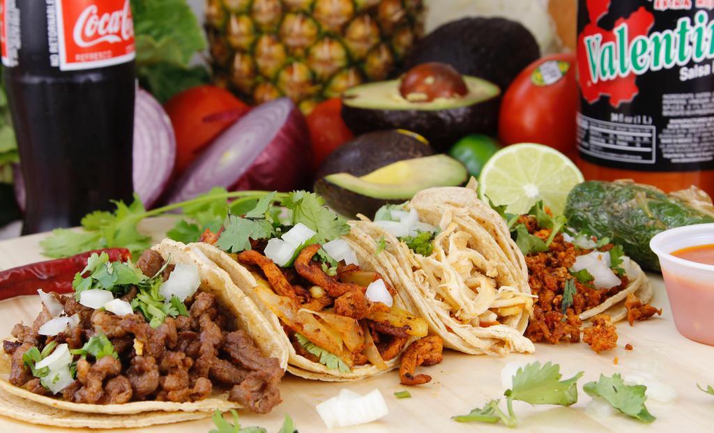 Tacos · Onion, cilantro, and sauce.