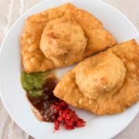 Vegetable Samosa (2Pcs) · Deep fried crispy turnovers filled with potatoes and green peas.