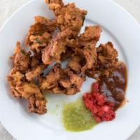 Vegetable Pakora (7Pcs) · Fritters of assorted vegetables dipped in spicy batter.