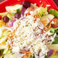 Greek Salad · Lettuce, tomato, kalamata, carrot, cucumber, beet, red onion, and feta.