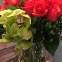 Flower Extasis · A beautiful color contrast contained in a tall glass cylinder. Long stem premium red roses a...