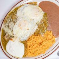 Chilaquiles Con Huevos Estrellados · Chilaquiles with eggs. Served with beans, rice.