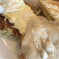 Country Fried Steak And Eggs · A country fried steak topped with peppered sausage gravy. Served with two fresh eggs from lo...