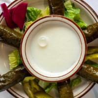 Veggie Grape Leaves · Grape leaves stuffed with a mix of rice, fresh vegetables, and herbs. Served with a side of ...
