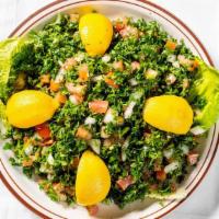 Tabbouleh Salad · Finely chopped tomato, fresh parsley, bulgur wheat, onion, and tossed in our zesty vinaigret...