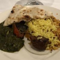 Palak Paneer · Spinach and chunk of paneer cheese served with rice.