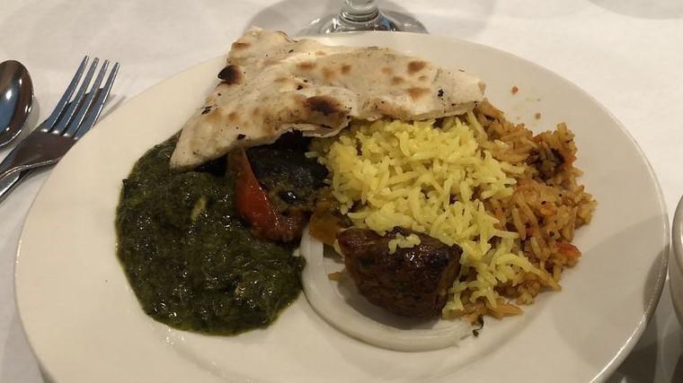 Palak Paneer · Spinach and chunk of paneer cheese served with rice.