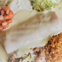 Chimichangas · Flour tortilla filled with your choice of meat, fried and covered with white queso, accompan...