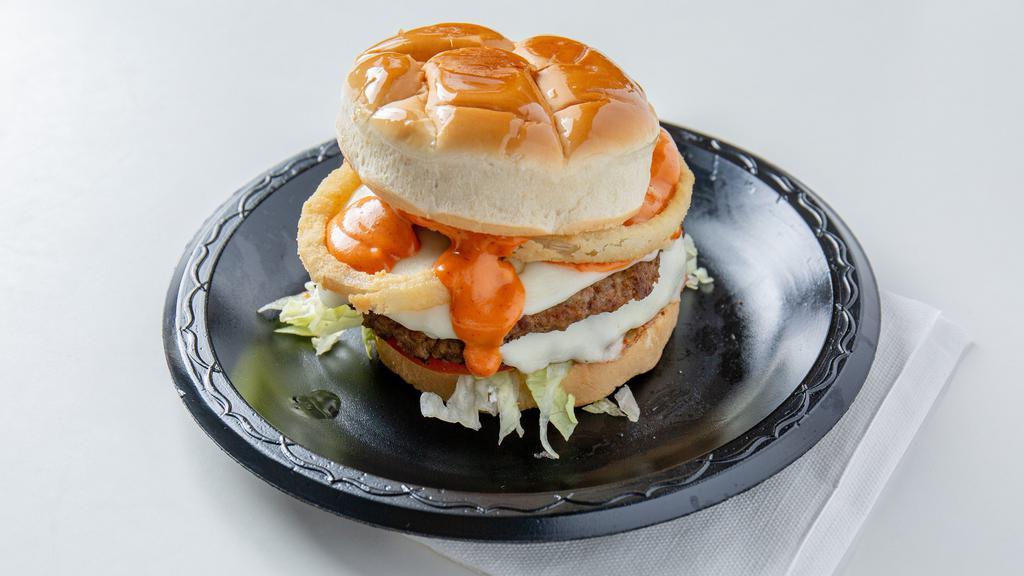 Double Diablo Burger · Two seasoned quarter pound patties, with lettuce and tomato, topped with pepper jack cheese, 2 onion rings, and our homemade Diablo sauce. Get any sandwich in a basket, includes fries, onion rings, and coleslaw.
