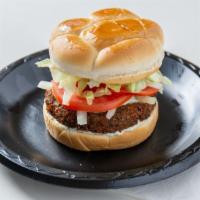 Falafel Burger · Vegetarian. Fried quarter pound falafel patty served on a toasted bun topped with lettuce, t...