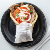 Gyros · Tender juicy gyros meat cut from the rotisserie. Wrapped in a grilled pita bread and topped ...