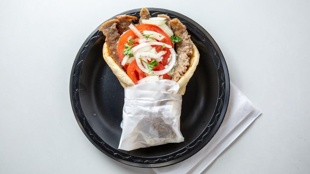 Gyros · Tender juicy gyros meat cut from the rotisserie. Wrapped in a grilled pita bread and topped with tomato, onions and our homemade tzatziki sauce. Get any sandwich in a basket, includes fries, onion rings, and coleslaw.