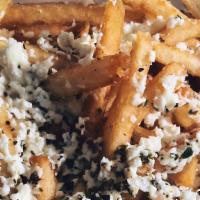Greek Feta Fries · French fries topped with feta cheese seasoning and our Greek vinaigrette dressing.