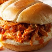 Bbq Pork And Chicken Sandwich · Smoked pulled chicken and pulled pork with coleslaw and bbq sauce on a fluffy bun.