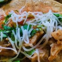 Ancho Chicken Taco - Single · Chicken marinated in mild ancho chile salsa, topped with cheese, onion & cilantro on corn to...