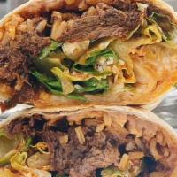Barbacoa Burrito · Slow-cooked, braised beef, Chihuahua cheese, fresh cilantro & onion, sour cream, Mexican ric...