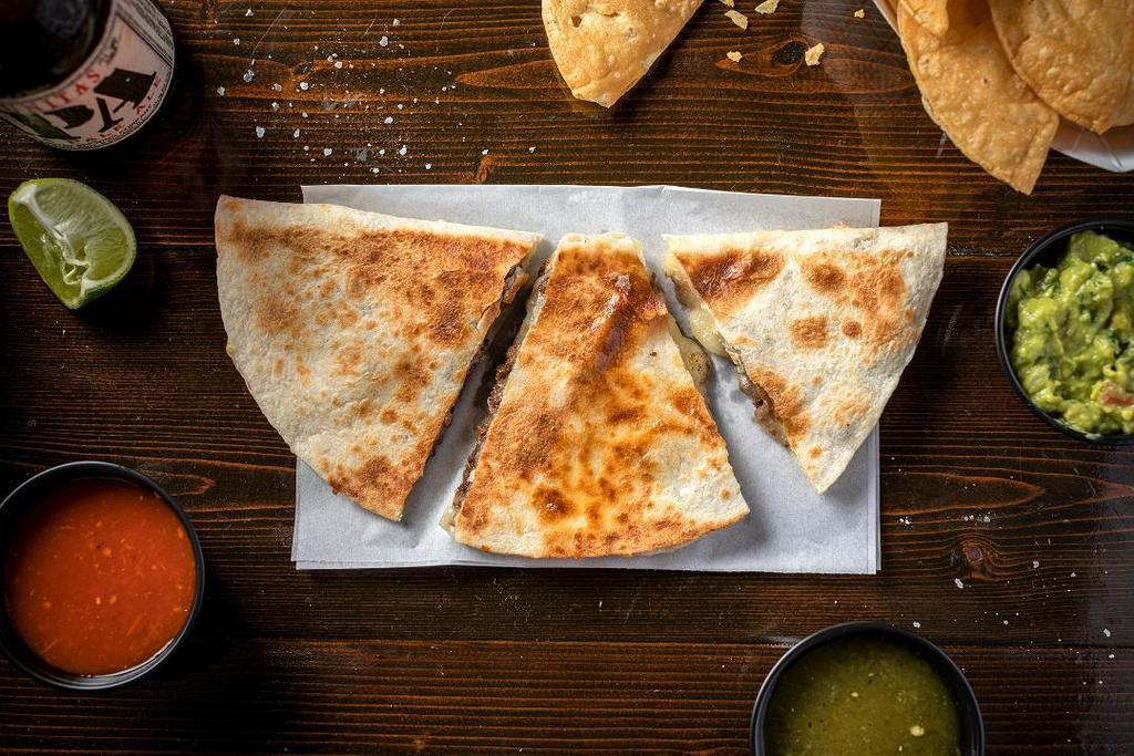Quesadilla Con Carne · Your choice of Al Pastor, or Lime-Grilled Steak, with. Chihuahua cheese.