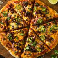 Taco Special Pizza · Delicious Pizza topped with Beef, onions, olives, after cooked- topped with lettuce and toma...