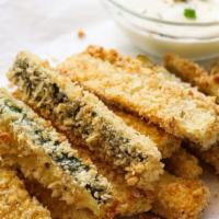 Fried Zucchini · Fresh zucchini, breaded and deep fried to a golden brown color.