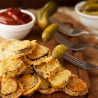 Fried Pickles · Fresh pickles, breaded and deep fried to a golden brown color.