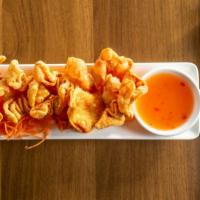 Crab Rangoon · Deep fried wonton wrapped with blended crab, cream cheese and celery.