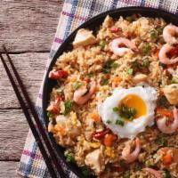 House Fried Rice · Delicious mix of chicken, steak, shrimp, and vegetables with fried rice. Served with custome...