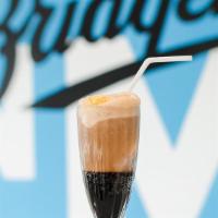 Root Beer Float · Vanilla ice cream in a glass of old fashioned root beer