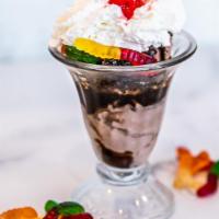 Dirt And Worms Sundae · Chocolate ice cream topped with crushed Oreos, chocolate syrup, gummy worms, whipped cream, ...