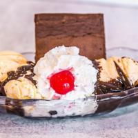 Brownie Sundae · Vanilla ice cream on a chocolate brownie topped with hot fudge, whipped cream, and a cherry.