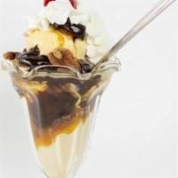 Turtle Sundae · Vanilla ice cream, hot fudge, caramel and spanish peanuts topped with whipped cream and a ch...