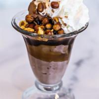 Snicker Sundae · Chocolate ice cream, hot fudge, caramel and Spanish peanuts topped with whipped cream and a ...