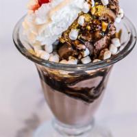 Campfire Sundae · Chocolate ice cream, chocolate syrup, mini marshmallows and crushed graham crackers topped w...