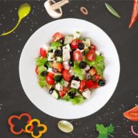 Greek Salad Getaway · Salad with cucumbers, lettuce, onions, crumbled feta cheese, pepperoncini, and olives. Serve...
