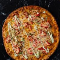 Chicken Tikka Pizza · Pizza loaded with tikka masala, mozzarella, paneer, onions, green peppers, moti sauce, cilan...